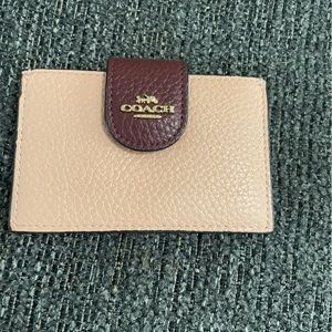 Coach card holder in color block.